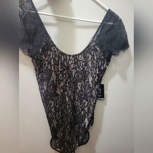 Express lace body suit with see-through back.